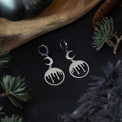 Boucles d'oreilles boule à neige ensanglantée en acier