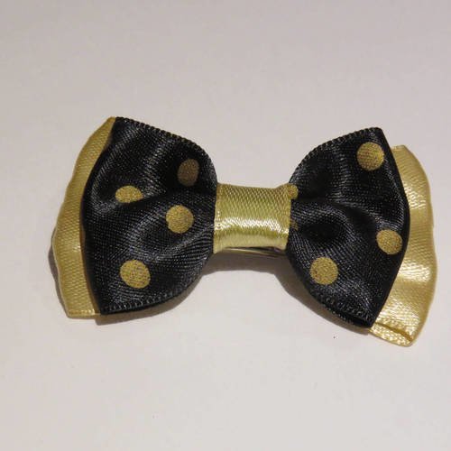 Barrette plastique 4 cm avec petit noeud papillon en tissu satin or et noir à gros pois 