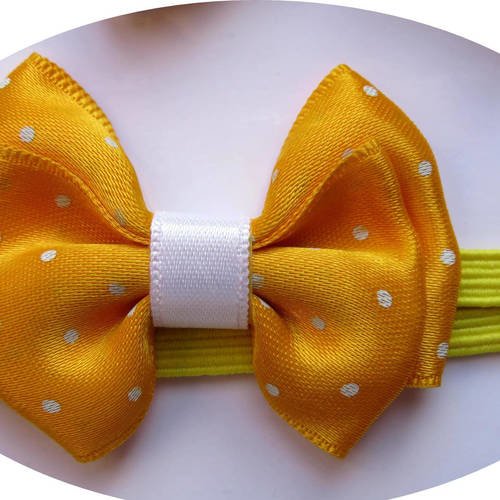Bandeau headband élastique avec noeud papillon en tissu satin jaune à petits pois blancs 