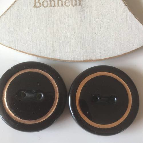2 boutons en céramique forme ronde noir et contour doré diamètre 37mm
