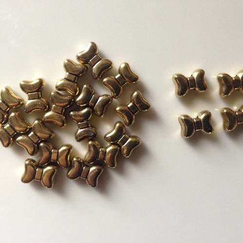 Lot de 4 perles métal doré noeud 9x5mm percées