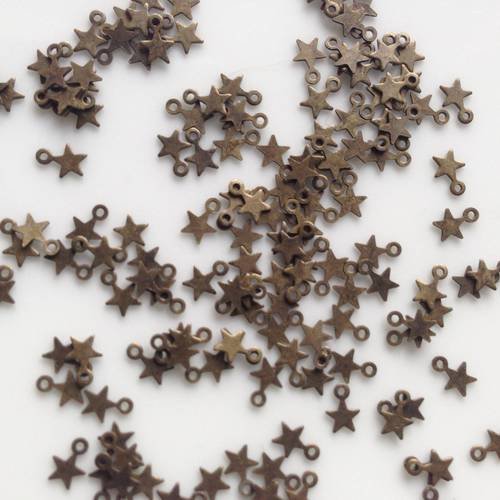 Lot de 10 mini breloques étoiles en bronze 5mm 
