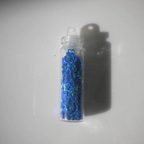Fiole en verre 3cm avec des micropaillettes fleur en bleu 