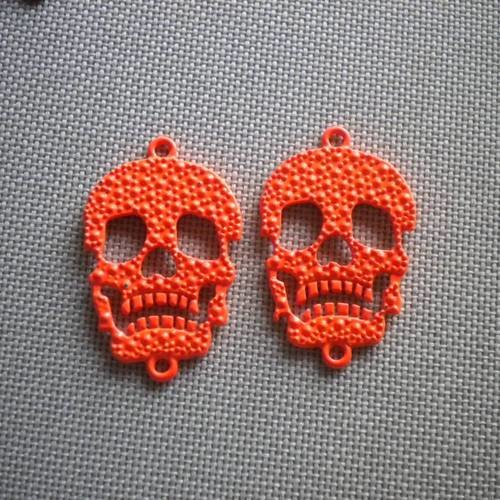 Duo de perles têtes de mort en métal orange 2 piquots 