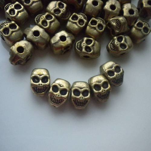 Lot de perles bronze têtes de mort x5 