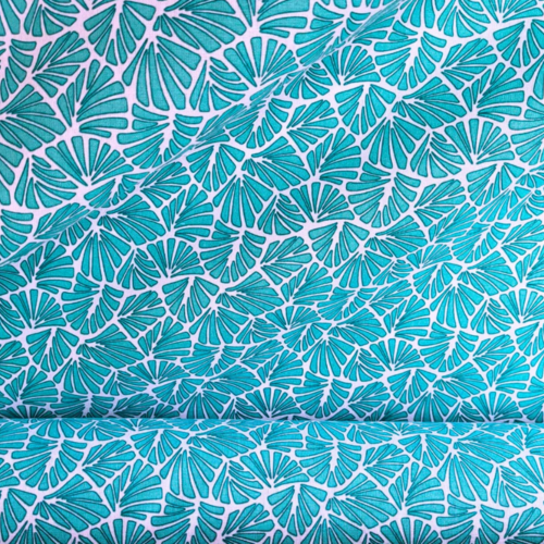Tissu coton imprimé feuilles turquoise en 160 cm de large