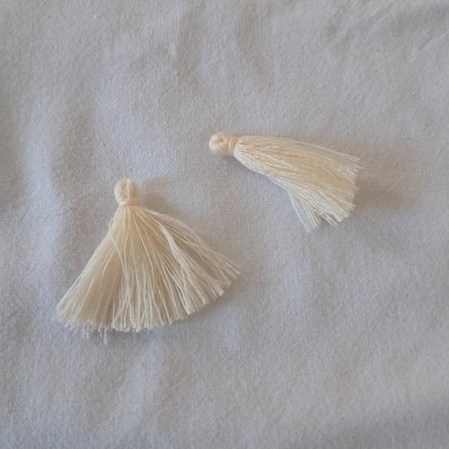 Pompons en coton blanc cassé