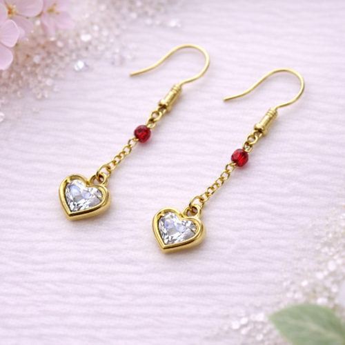 Boucles d’oreilles dorées pendantes strass cristal