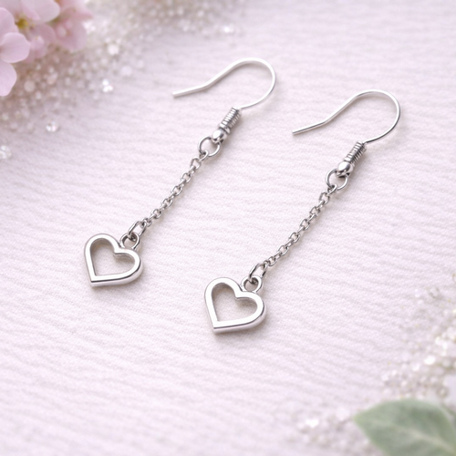Boucles d’oreilles pendantes cœur argenté – élégantes