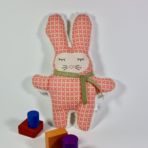 Doudou lapin orange-rose.