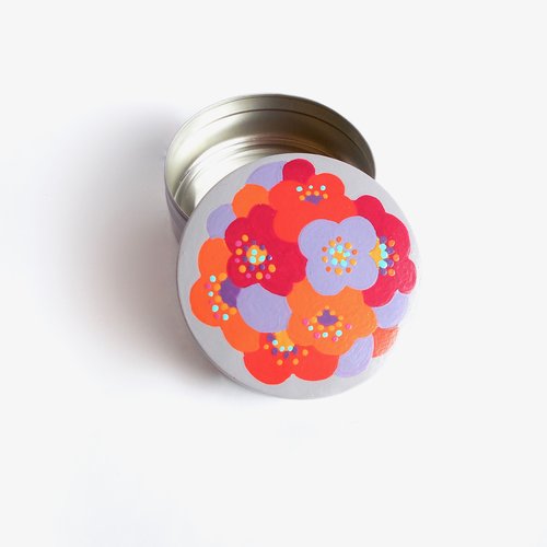 Boite ronde en métal mauve à fleurs pop multicolores