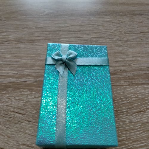 Écrin cadeaux scintillant et  brillant avec petit noeud turquoise