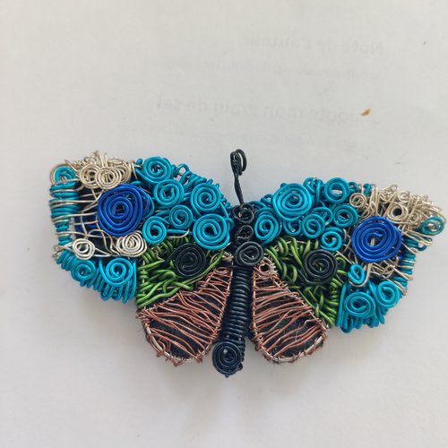 Pendentif papillon acier multicolore
