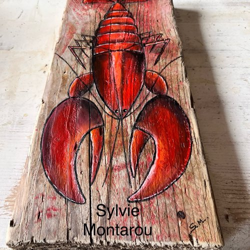 Le homard peint sur bois flotté