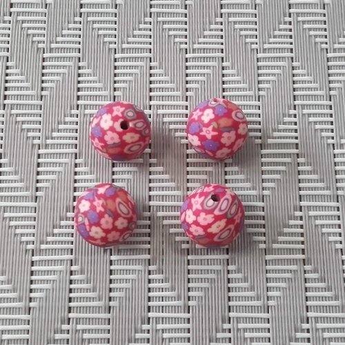 X 4 perles en pâte polymère rondes de 12mm. motifs fleurs sur fond rouge. lot de 4.