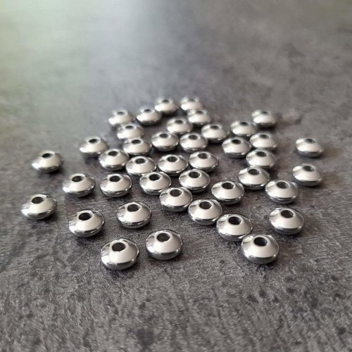 X10 perles intercalaires en acier inoxydable. 6 x 3mm. rondelles, soucoupes. perles rondes et plates.