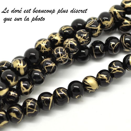 1 fil de 140/145 perles 6mm noires et tréfilé doré