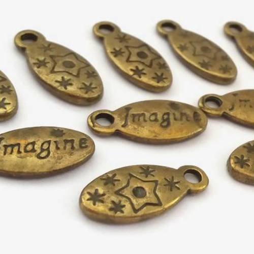 10 breloques ovales "imagine" et petites étoiles bronze sans nickel, 7x16mm (bre366) 