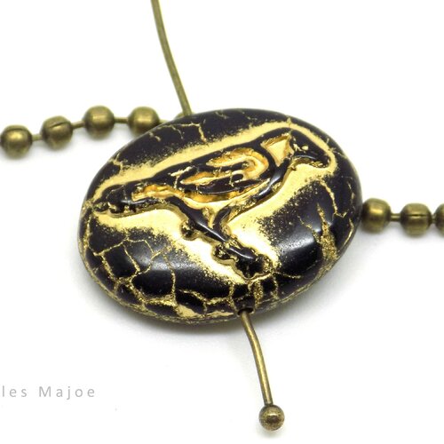 Perle tchèque corbeau, ovale, opaque, verre pressé, noir, patine or antique, 22 x 16 mm, vendue à l'unité