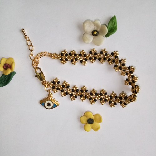 Bracelet gourmette perles de rocaille dorées et noirs pendentif " oeil porte bonheur "