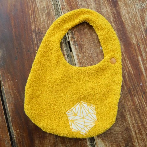 Bavoir motifs géométriques jaune curry
