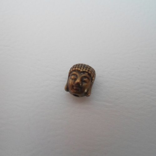 Breloque ou perle tete de bouddha couleur bronze