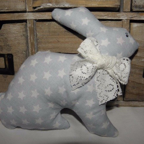 Doudou lapin en tissu  bleu ciel avec des étoiles pour les bébés et les enfants 