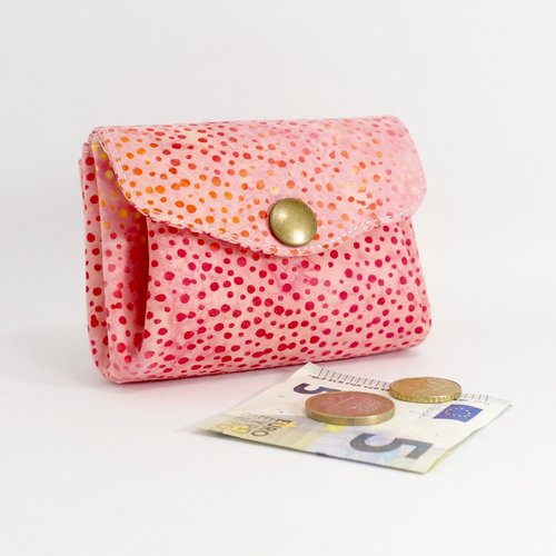 Porte-monnaie en tissu batik moucheté rose et jaune, 3 poches en accordéon.