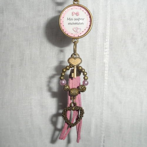 Porte clés / bijou de sacs cabochon " ma super maman  " métal bronze et pompon rose 