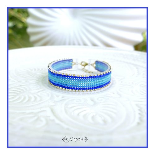 Bracelet tissé à l'aiguille perles de verre japonaises en dégradé de bleu et argentées fermoir acier inoxydable (#bc526)