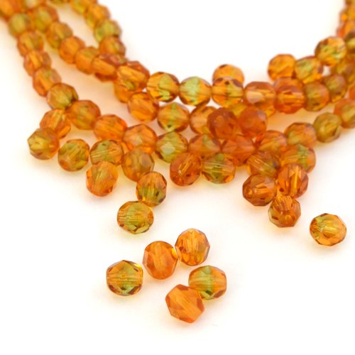 25 perles en verre ambre et vert à facettes 6 mm