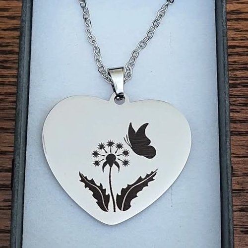 Pendentif coeur en inox "fleurs et papillons""