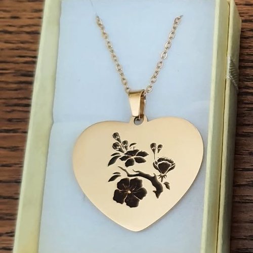 Pendentif coeur en inox doré "fleurs""