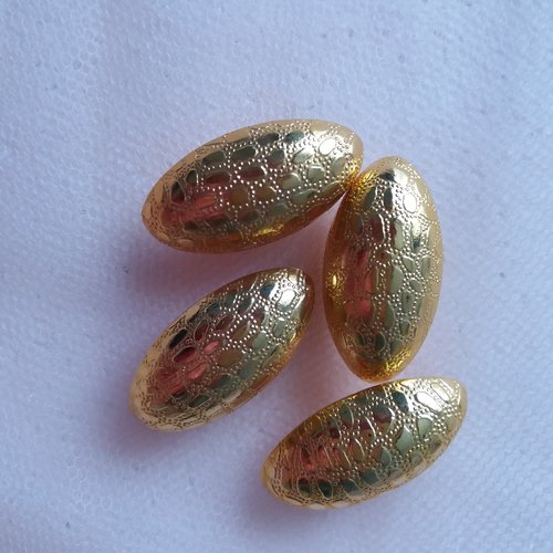 4 gros boutons fantaisie dores, ovales