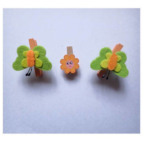 Pinces à linge fleur orange et papillons x3