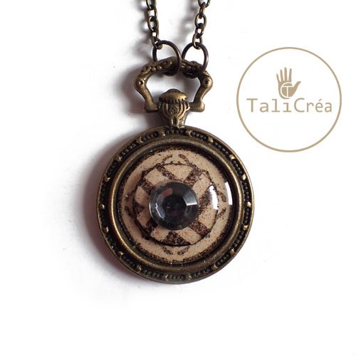 Collier montre motifs de ronds superposés en sables avec strass