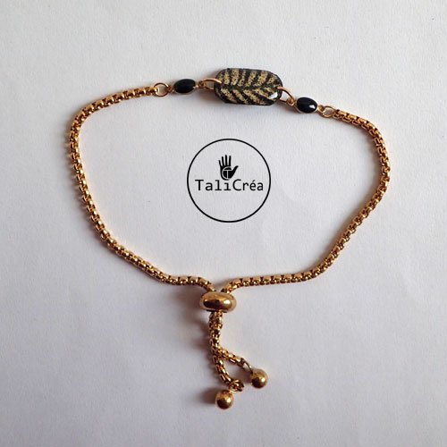 Bracelet en acier doré avec sables noirs et jaunes