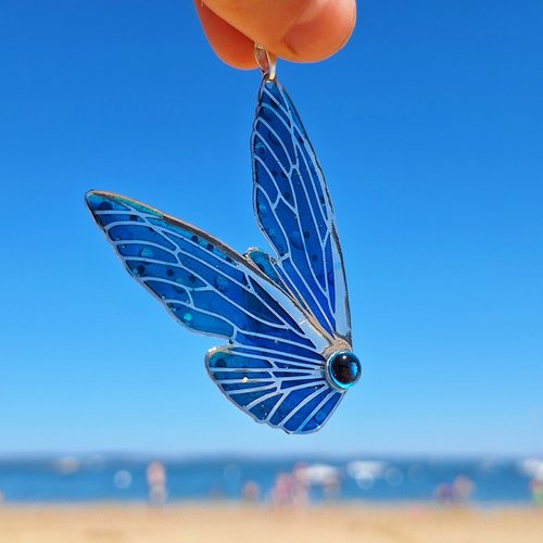 Collier papillon lumineux
