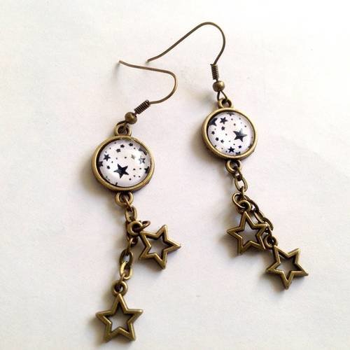 Boucles d'oreilles pendantes, étoiles, en bronze. 