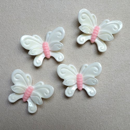 4 cabochons blancs forme papillon