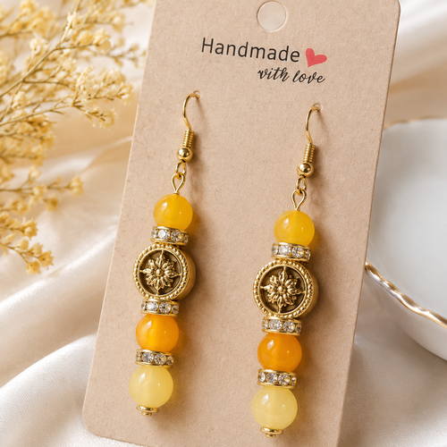 Boucles d’oreilles « soleil d’or » – un biais d’amour