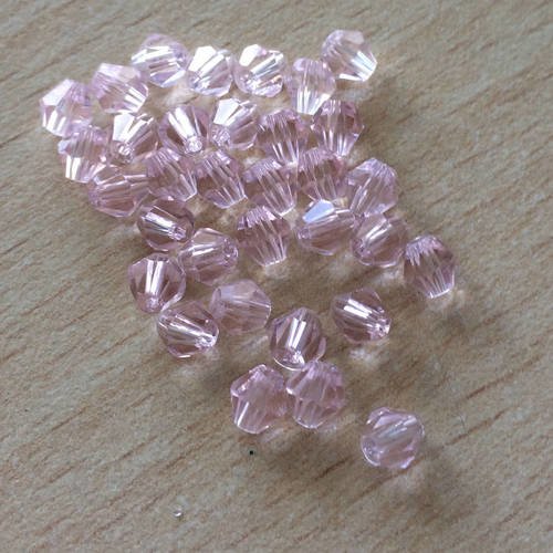 Sachet de perles à facettes bicône  rose orchidée 