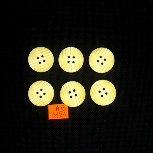7 boutons en résine jaune pale - 22mm - ab3186