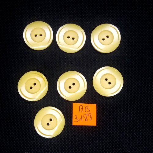 7 boutons en résine jaune pale - 22mm - ab3188