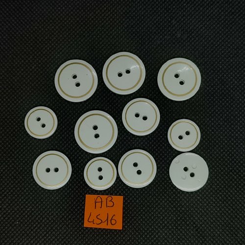 11 boutons en résine blanc avec un liserai doré - taille diverse - ab4516