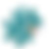 23 boutons en coco bleu (fleur) - 15mm - tr3253