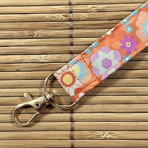 Porte-clés lanière orange à fleurs multicolores
