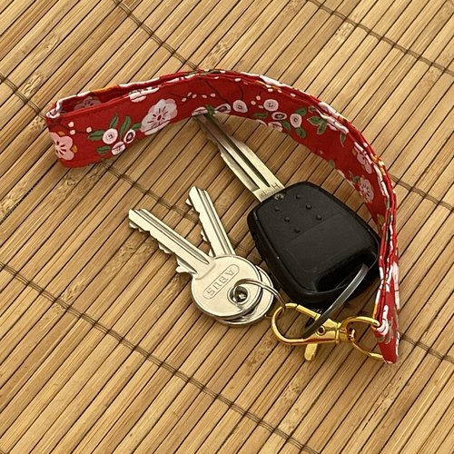 Porte-clés lanière rouge à fleurs