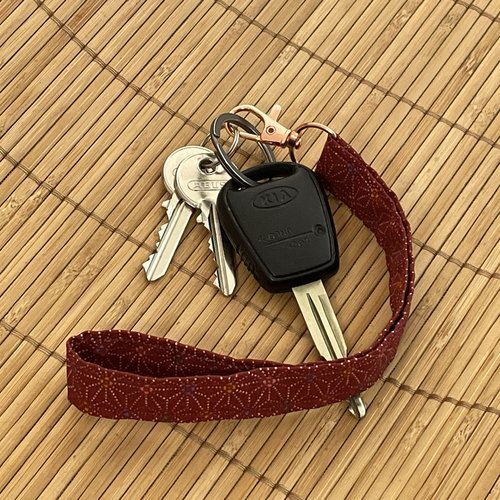 Porte-clés lanière bordeaux à petits motifs