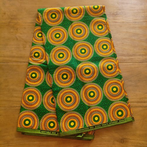 Tissu wax - par 50 centimètres - petits disques multicolores sur fond vert -100% coton - tissu africain - pagne